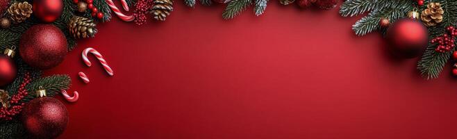 Festive holiday decorations with ornaments and candy canes on a red backdrop photo