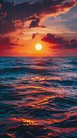 Sunset over the ocean with vibrant colors reflecting on the water in a tranquil setting photo