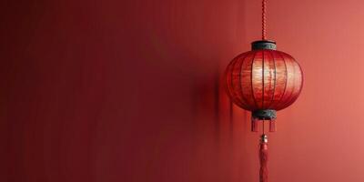 Beautiful red Chinese lantern hanging in a decorated room with ornate wall and trim details photo
