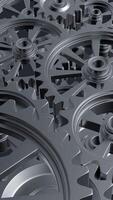 A close-up perspective showcases a series of rotating interlocking metal gears, highlighting the precise engineering and the complexity of mechanical design in machinery. vertical footage video
