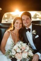 Happy couple celebrating their wedding day while seated in a car under a sunset glow photo