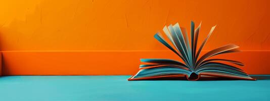 Open Book on Blue and Orange Background photo