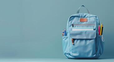 Blue Backpack on Blue Background photo