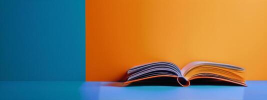 Open Book on Blue and Orange Background photo