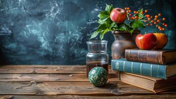 Stack of Books, Apple, and Orange on Table photo