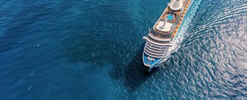 Luxury Cruise Ship Sailing Through Clear Blue Ocean Waters photo