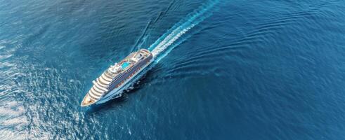 Luxury Cruise Ship Sailing Through Clear Blue Ocean Waters photo