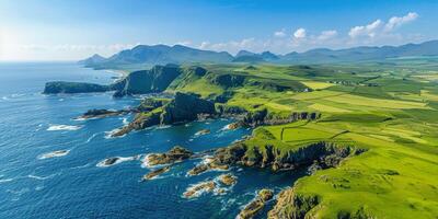 Stunning coastal cliffs and green hills at sunrise along the rugged shoreline in Ireland photo