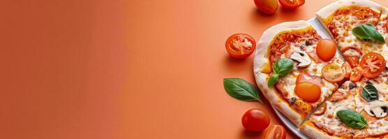 Heart-Shaped Pizza Topped With Fresh Tomatoes and Basil on a Orange Background photo