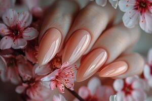 Elegant manicure showcased among delicate cherry blossoms in springtime beauty photo
