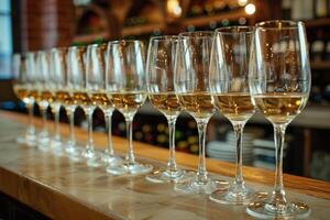Elegant wine tasting setup with various glass types arranged on a marble counter photo