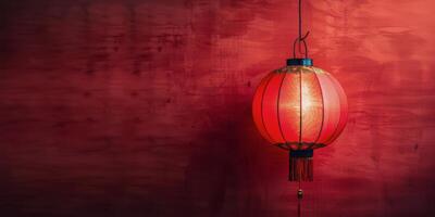 Beautiful red Chinese lantern hanging in a decorated room with ornate wall and trim details photo