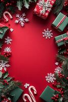Festive Christmas decorations with gifts, candy canes, and holiday greenery on a red background photo
