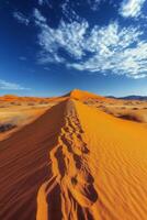 Expansive desert landscape with golden sand dunes under a bright blue sky and fluffy clouds photo