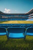 Empty blue stadium seats under a bright sky during an afternoon event at a sports venue photo