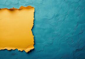 Textured yellow paper against vibrant blue background creating visual contrast and interest photo