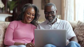 Happy couple enjoying video call at home on a cozy afternoon in their living room photo