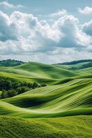 Lush green rolling hills under a partially cloudy sky in a serene landscape during midday photo