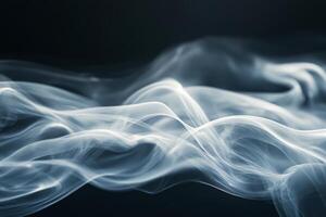 White smoke swirling against a dark background, creating an abstract and atmospheric effect photo