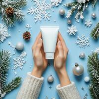 Winter skincare routine with a moisturizer tube and holiday decorations on a blue background photo