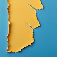 Bright yellow torn paper on a blue background highlighting creative design possibilities photo