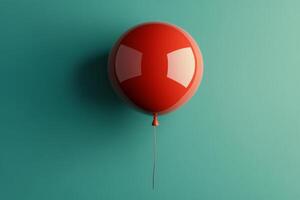 A vibrant red balloon floats against a textured green wall in a bright indoor setting photo