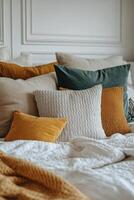 Cozy bedroom setting with colorful pillows and a warm atmosphere during the day photo