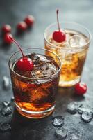 Two refreshing cocktails with cherries served on ice in stylish glasses on a marble surface photo