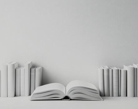 A collection of vintage books with an open book in front on a white background photo