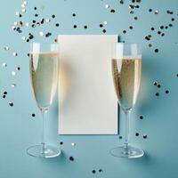 Celebration with sparkling drinks and colorful confetti on a blue backdrop during a festive occasion photo