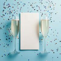 Celebration with sparkling drinks and colorful confetti on a blue backdrop during a festive occasion photo
