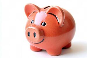 A close view of a pink ceramic piggy bank on a white background at home photo