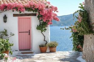Charming pink door framed by vibrant bougainvillea near the stunning coast in Santorini, Greece photo
