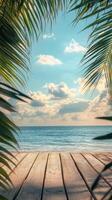 A serene beach view framed by palm leaves under a clear sky with gentle waves on a sunny day photo