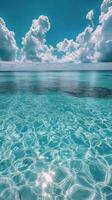 Exploring the crystal clear waters under a bright sun with fluffy clouds on a calm day photo