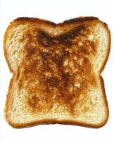 Toasted bread slice with unique burn design on a white background capturing warmth and texture photo