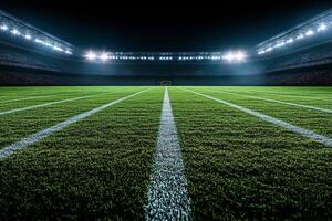 Nighttime view of a well maintained soccer field illuminated by stadium lights during a game photo