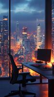 A modern workspace with a view of the illuminated New York City skyline at night photo