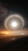 A full moon shining brightly above clouds during a serene night sky photo