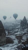 Hot air balloons soaring over the unique rock formations in Cappadocia at sunrise photo