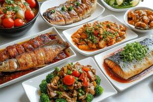 Grilled fish platter with assorted sides served at a festive gathering photo