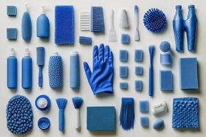 A collection of various blue cleaning supplies arranged neatly on a flat surface for organization photo