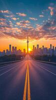 Sunset view of Toronto skyline with the CN Tower from a wide road in the foreground photo