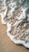 Gentle waves touch sandy shore with smooth stones on a sunny day at the beach photo