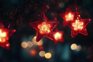 Red glitter star decorations shining brightly at night during the festive holiday season photo