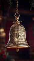 Ornate bell hangs delicately in a warm, vibrant indoor space for the holidays photo