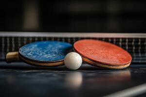 A close view of a table tennis game in progress with balls and net under dramatic lighting photo