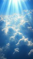 Radiant beams of sunlight breaking through dark storm clouds in a dramatic sky during the day photo