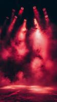 Bright red beams of light shining through smoke during an evening event photo