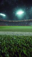 Bright stadium lights illuminate the empty soccer field during a nighttime event photo